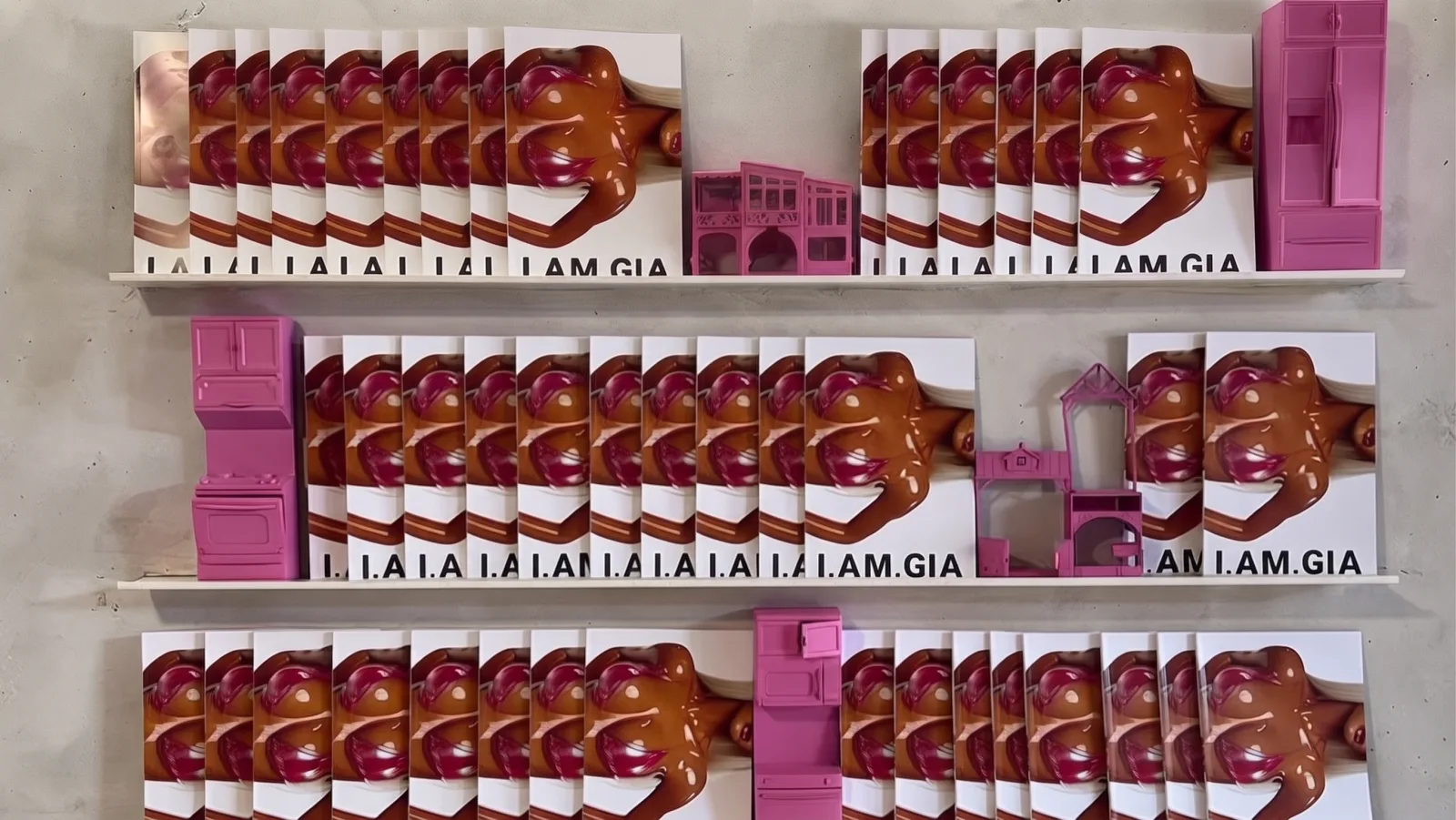 I.AM.GIA — The product wall: the hearts and the I.AM.GIA boxes on shelves