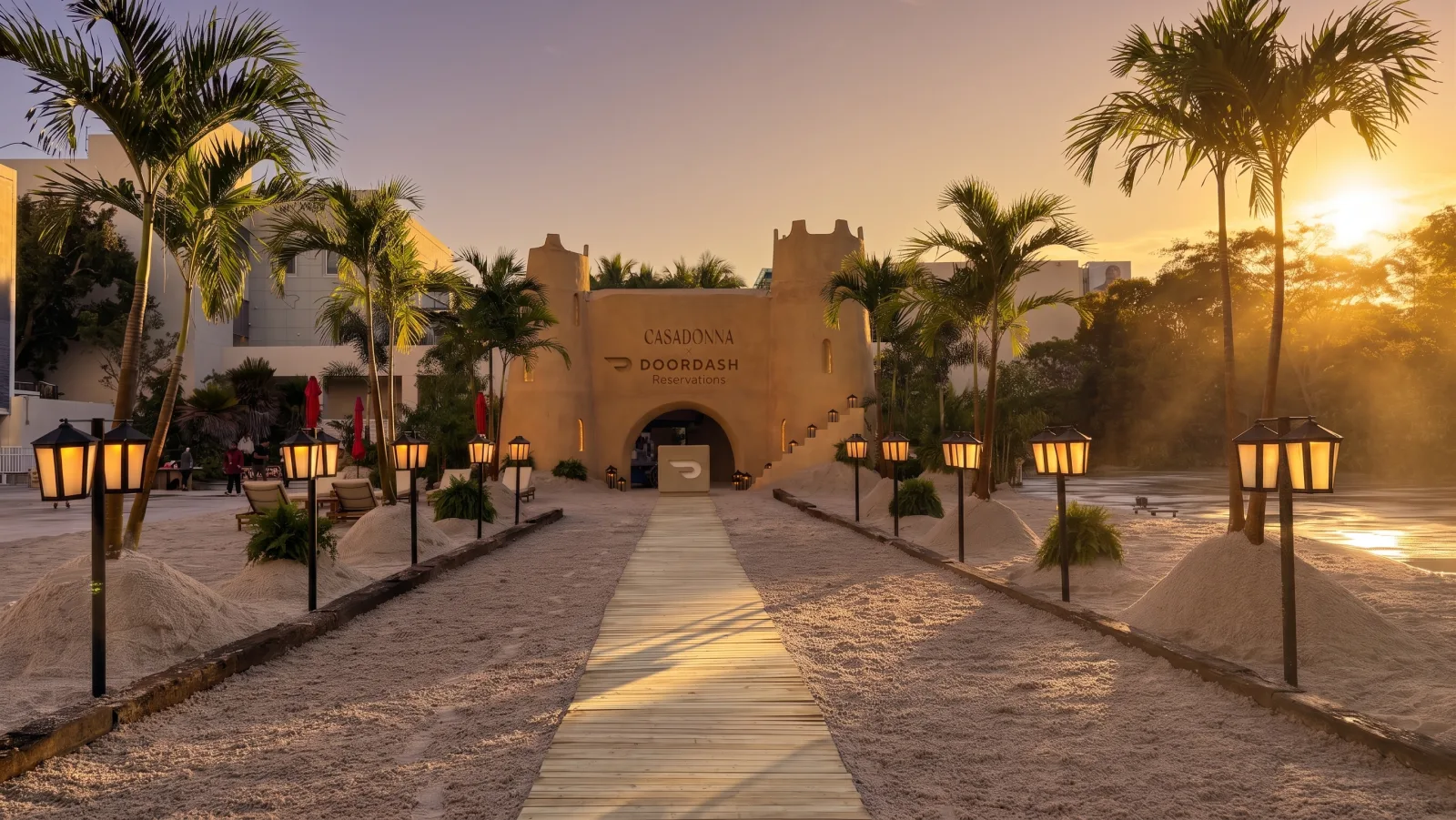 DOORDASH — The castle at sunset, at the end of the lantern walkway