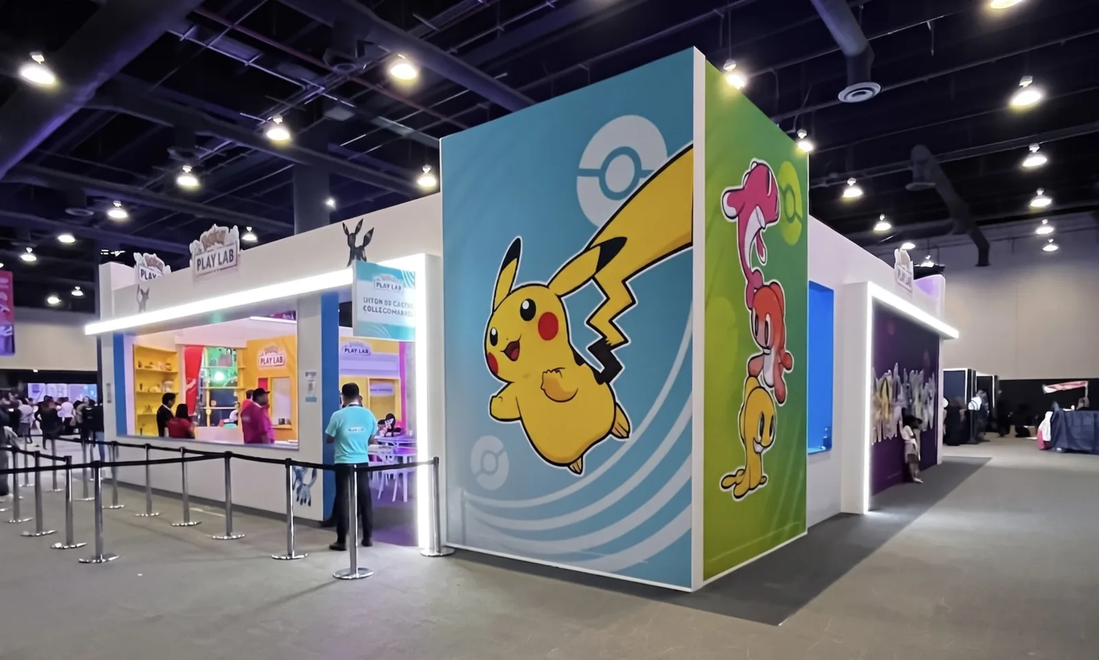POKEMON PLAY LAB — Pikachu at wall scale on the pavilion corner, the line coming in